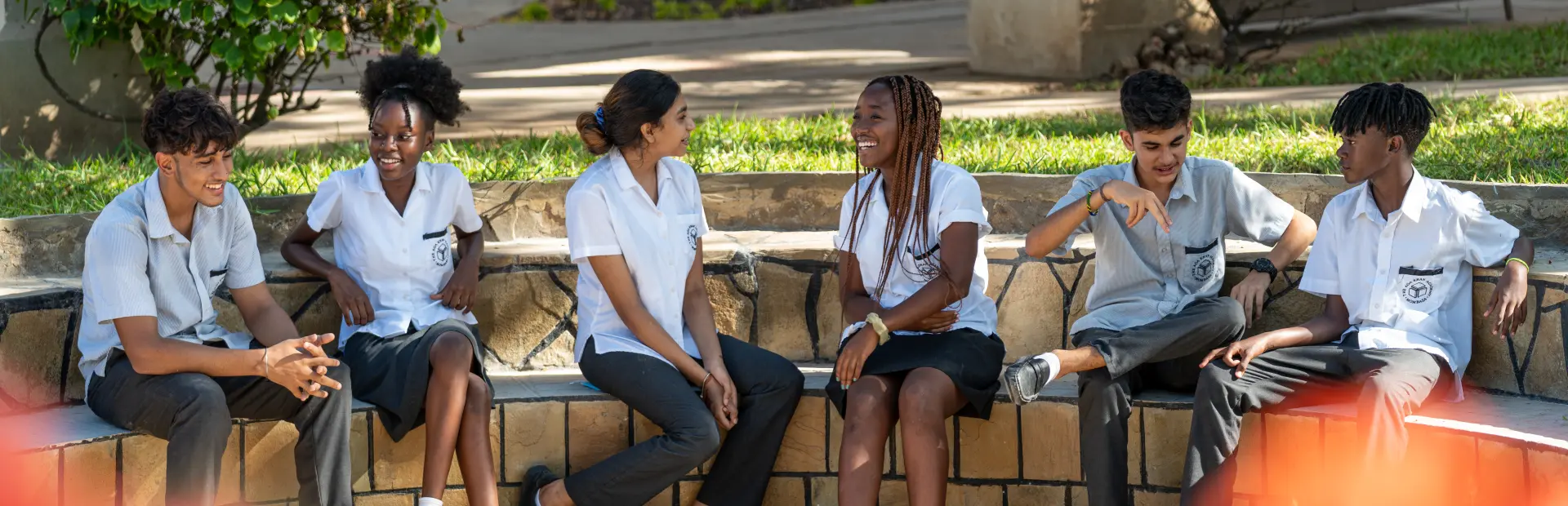 Students sitting in a group, having discussions.