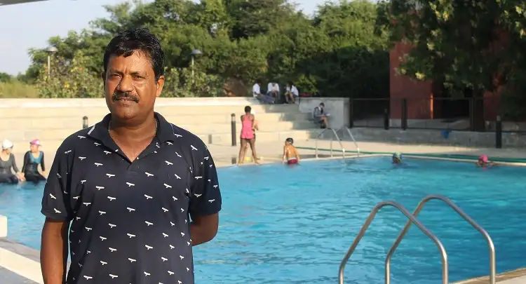<p>Professional swimmer K. Surendra leads Academy swim team to victory</p>