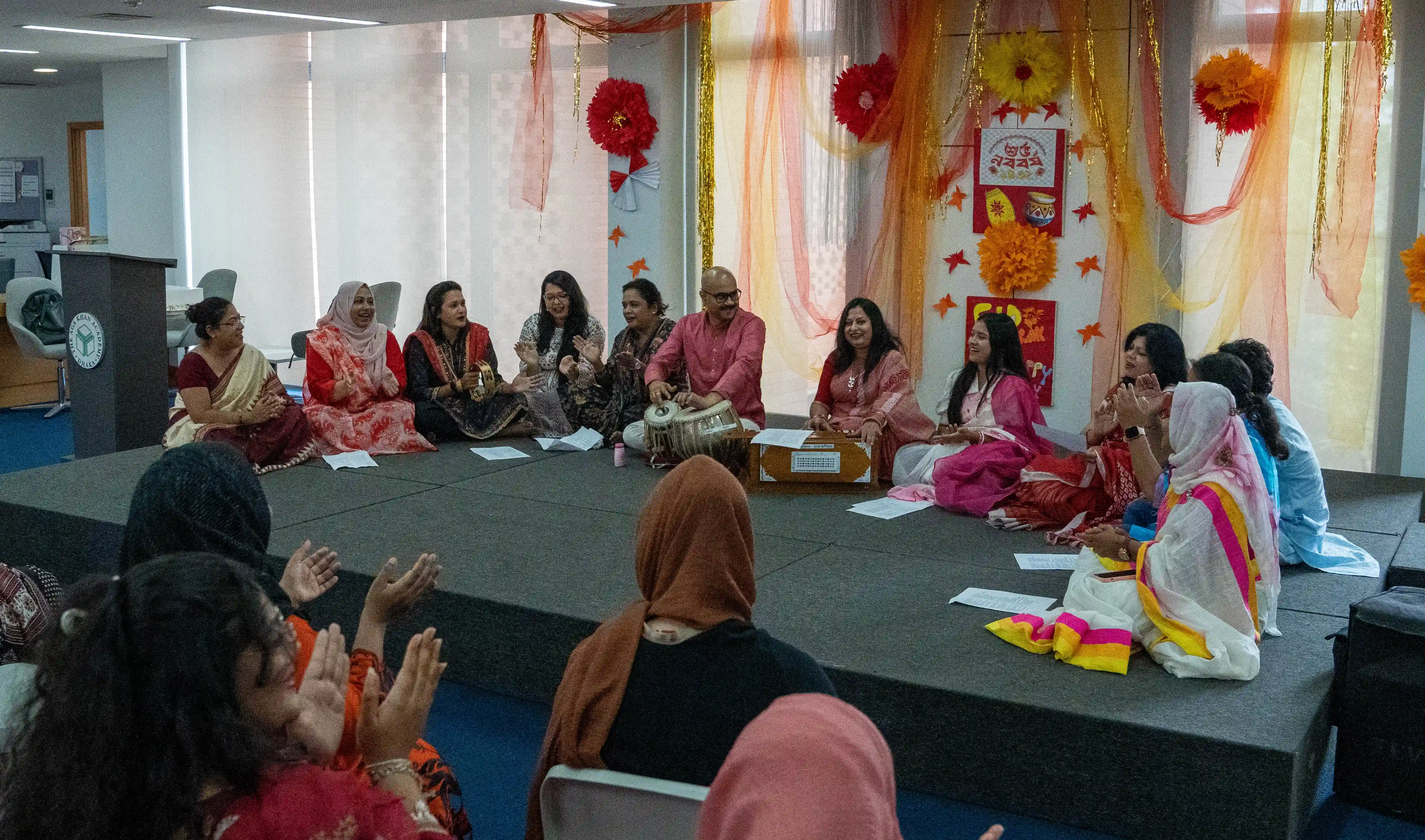 Teachers perform music together during a professional development event at AKA Dhaka.