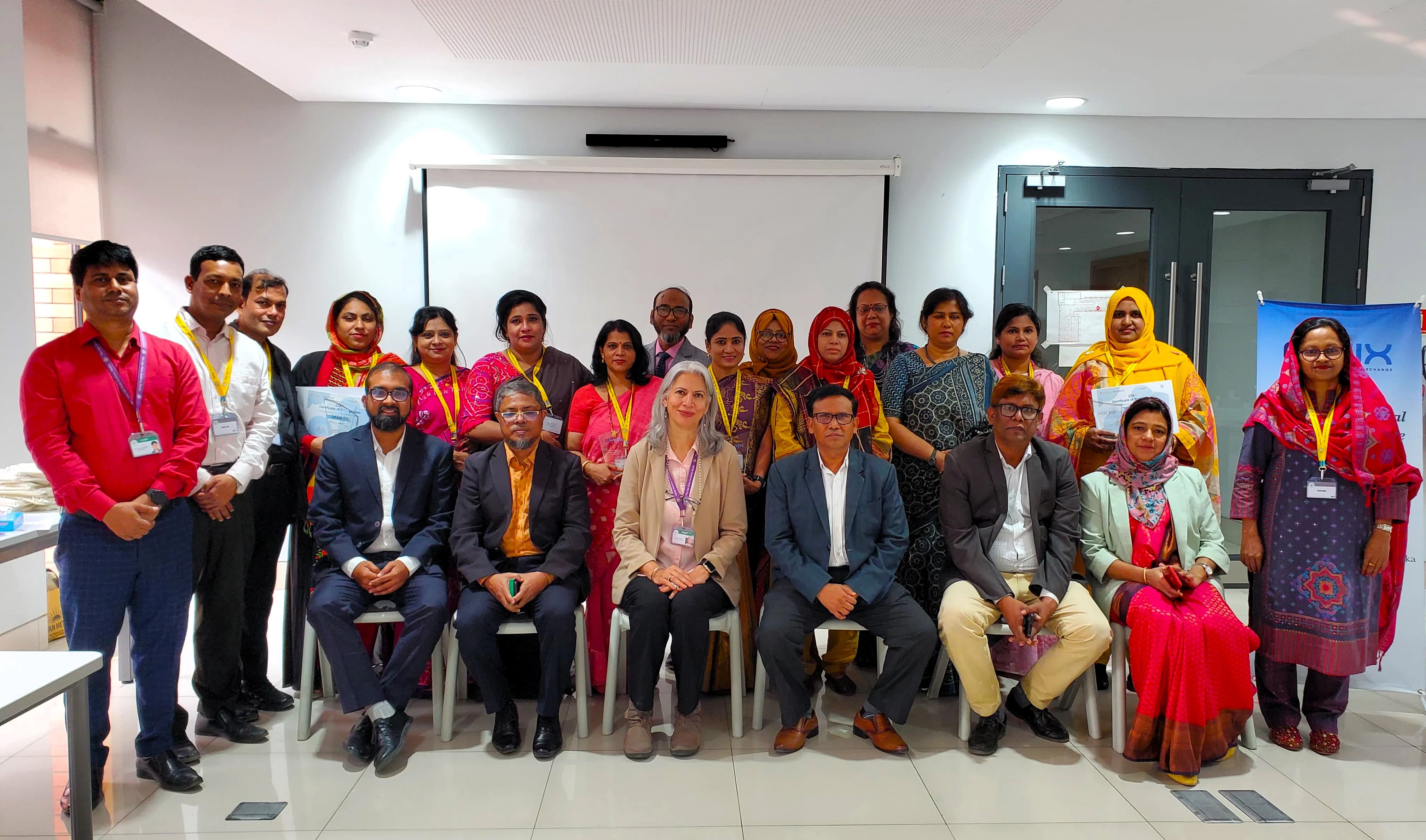 A group of educators pose together after a Professional Development Centre outreach session at the Aga Khan Academy Dhaka.