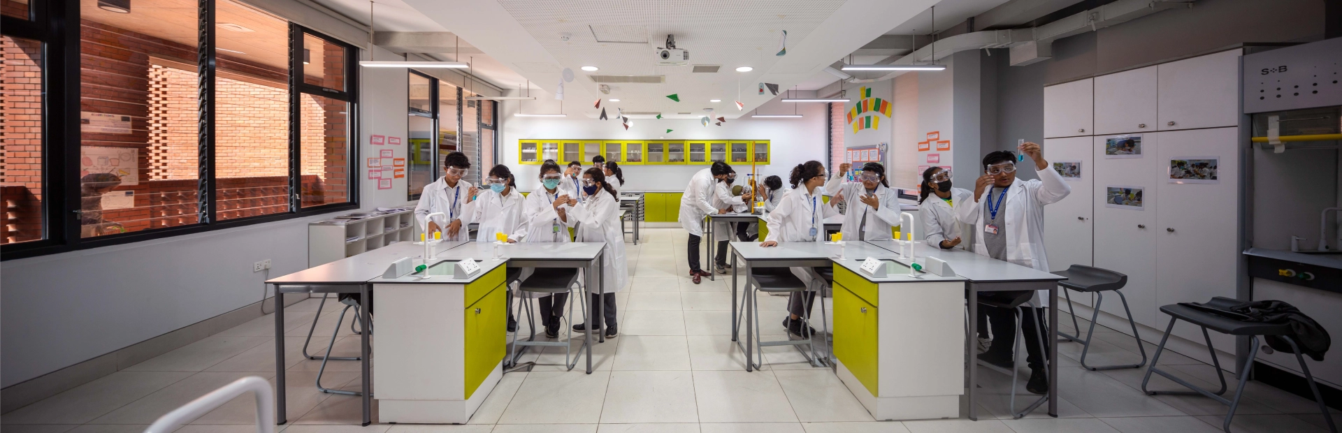 Students participate in a science activity inside a classroom.